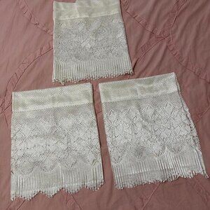 3 Cream color lace window valances with scalloped bottom. (